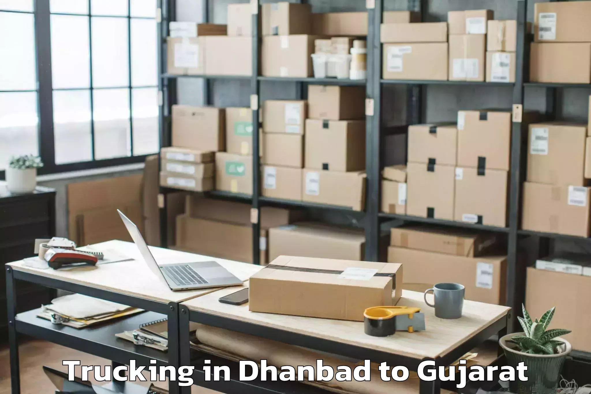 Affordable Dhanbad to Jhalod Trucking